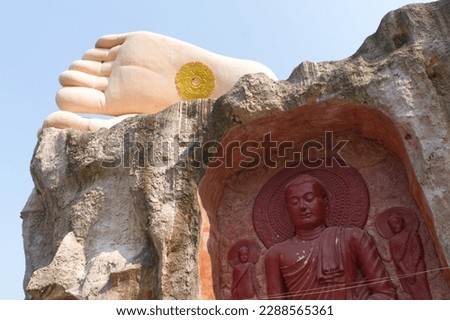 Buddhist temple and monastery built à la Antoni Gaudi, inspired by the forms of nature, a monumental reclining Buddha dominates the valley (War Huai Prep Wararam) Royalty-Free Stock Photo #2288565361