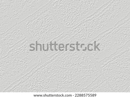 On a light gray paper wallpaper with a texture of bricks arranged diagonally.