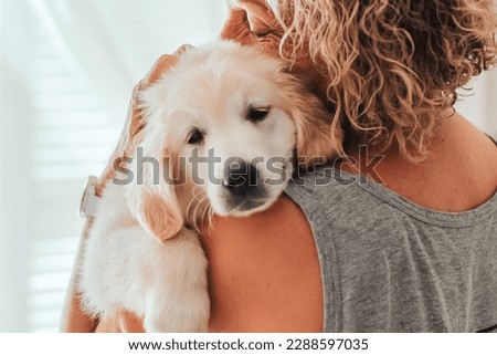 portrait depressed senior woman hugging dog puppy golden retriever pet therapy canisterapy old adults emotion mental health friends love tightly depression,anxiety,tired elderly cry alone home Royalty-Free Stock Photo #2288597035