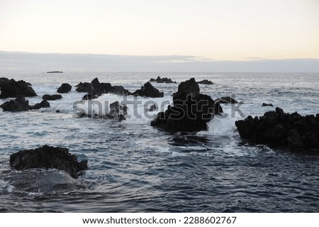 Waves breaking and crushing on the rocks on the Atlantic Ocean on coastline and seashore of Madeira Island , Portugal, Europe