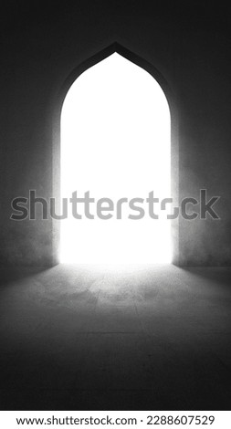 Mosque door with a bright light background Royalty-Free Stock Photo #2288607529