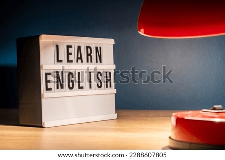 Learning English concept. Learn English on white letter board. Language learning concept background
