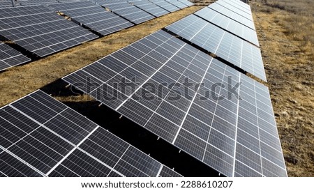 Solar power plant. Flight over modules of solar power station on sunny day. Alternative green electricity power. New modern technology. Renewable electrical energy. photovoltaic modules photobatteries Royalty-Free Stock Photo #2288610207