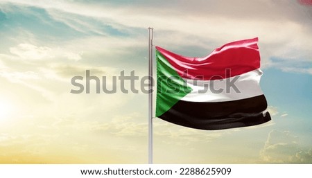 Waving flag of Sudan in beautiful sky. Sudan flag for independence day. Royalty-Free Stock Photo #2288625909