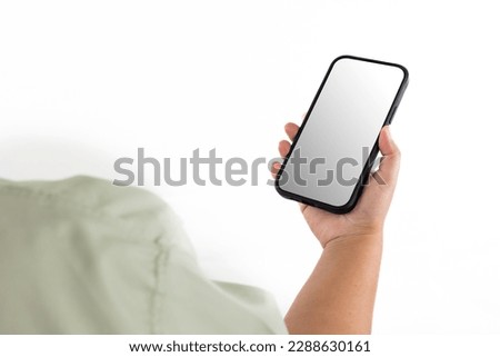 Mobile phone blank screen isolated on white background and banner. Female hand holding mock up smartphone.
