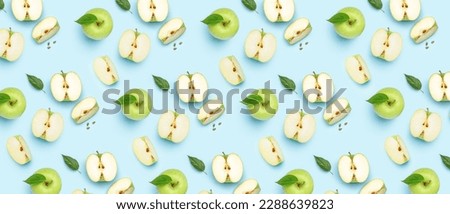 Many ripe apples on light blue background. Pattern for design