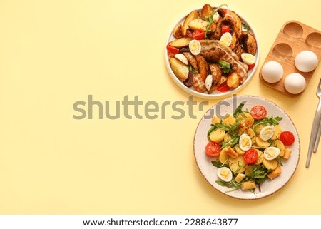 Plates of different potato salads on beige background, top view