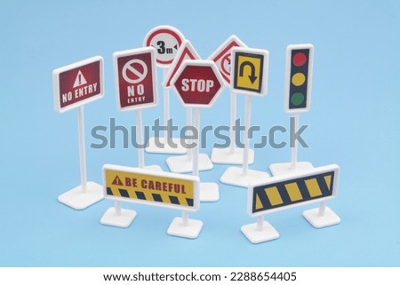 Many road signs on blue background.
