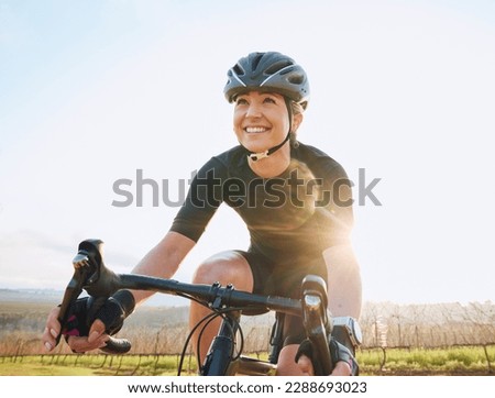 Cycling, fitness and happy with woman in park for training, workout and cardio health. Exercise, travel and freedom with female cyclist riding on bike in nature for adventure, journey and transport Royalty-Free Stock Photo #2288693023