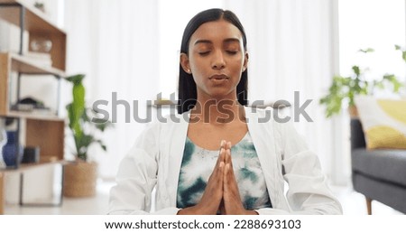 Zen woman calm meditation and breathing sitting alone on floor in living room. Tranquil, bliss, young girl daily spiritual detox for stress relief, peace, serene and chakra, yoga, relax and unwind. Royalty-Free Stock Photo #2288693103