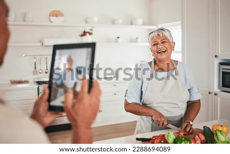 Cooking food, elderly couple and tablet photo of senior woman, wife or person with digital memory picture. Vegetables nutritionist, photography shooting and laughing people bonding in health kitchen