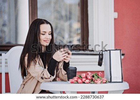 Best Dating Apps for Women. Dating apps turning to AI and Chatbot to help find love. Happy smiling woman with flowers bouquet using social media or chatting on mobile phone