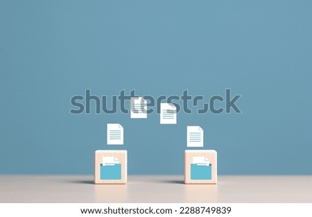 Data copy or move , Transfer files of data between folders, Backup data, Exchange of file on folder, Send document to the internet, Wooden blocks with virtual document loading to another folder. Royalty-Free Stock Photo #2288749839