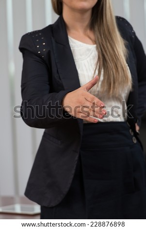 Businesswoman Extending Hand To Shake