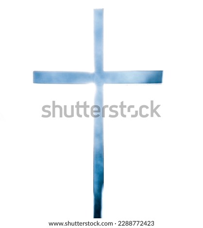 Christian cross with back lighting and smoke on white background for easter, religion, religious holiday or event