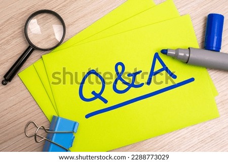 QA - Question and Answer - acronym text concept with blue marker on yellow card