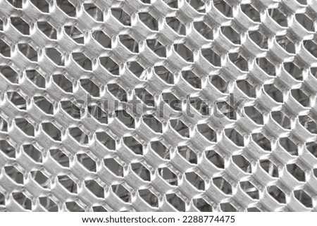 Texture or background of metal mesh with holes. Metal
