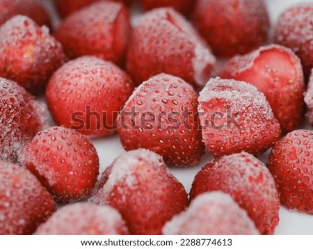 A background of frozen strawberries. Close up.