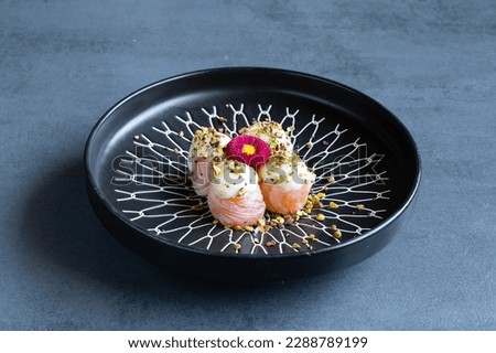 Gunkan Sushi, Japanese fish recipe with floral decoration. Royalty-Free Stock Photo #2288789199