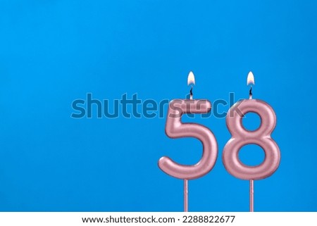 Candle number 58 - Birthday in blues foamy background