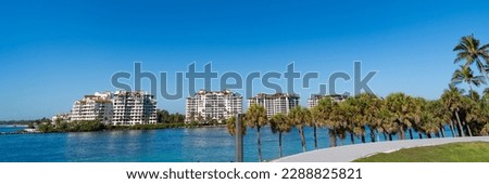 Fisher Island skyline with buildings and palms seen from bay in South Beach, USA