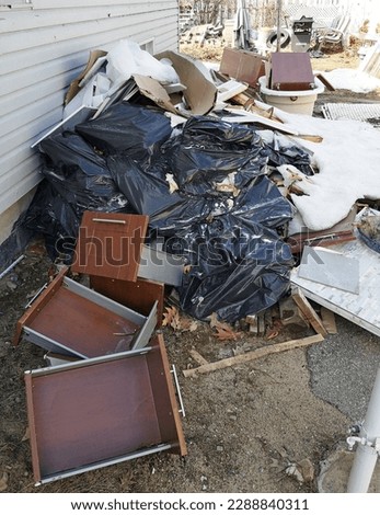 Image example - Accumulation of garbage and debris resulting from home renovation projects. The cluttered mess requires quick and efficient removal to restore order and safety to the space.