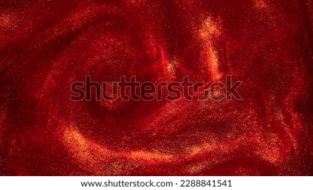 Whirling Gold Particles in Red Fluid. Magical waves of golden glittering particles in different shades of red liquid with depth of sharpness. Galaxy of countless golden dust particles. Royalty-Free Stock Photo #2288841541