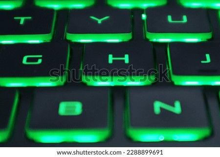 laptop keyboard with green light