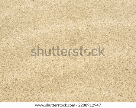 photo of sand with wind patterns, natural summer background.