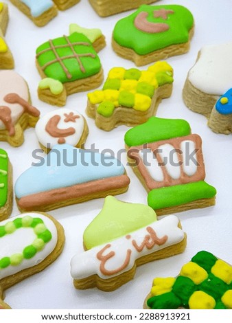 Eid Mubarak homemade gingerbread cookies on white background 
