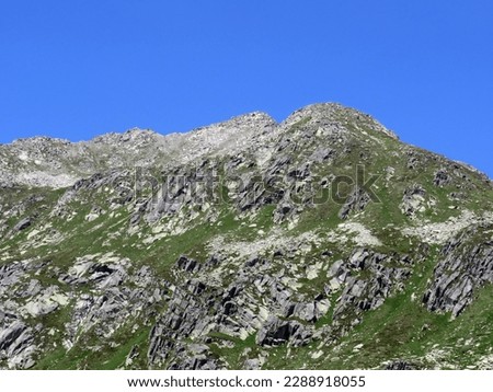 Rocky mountain peaks Poncione di Fieud (2696 m) and Fibbia (2738 m) in the massif of the Swiss Alps above the St. Gotthard Pass (Gotthardpass), Airolo - Canton of Ticino (Tessin), Switzerland (Schweiz Royalty-Free Stock Photo #2288918055