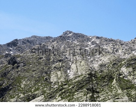 Rocky mountain peaks Poncione di Fieud (2696 m) and Fibbia (2738 m) in the massif of the Swiss Alps above the St. Gotthard Pass (Gotthardpass), Airolo - Canton of Ticino (Tessin), Switzerland (Schweiz Royalty-Free Stock Photo #2288918081