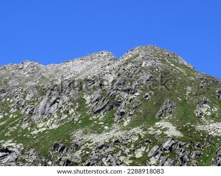 Rocky mountain peaks Poncione di Fieud (2696 m) and Fibbia (2738 m) in the massif of the Swiss Alps above the St. Gotthard Pass (Gotthardpass), Airolo - Canton of Ticino (Tessin), Switzerland (Schweiz Royalty-Free Stock Photo #2288918083
