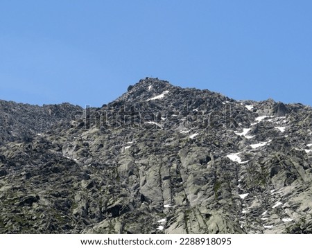 Rocky mountain peaks Poncione di Fieud (2696 m) and Fibbia (2738 m) in the massif of the Swiss Alps above the St. Gotthard Pass (Gotthardpass), Airolo - Canton of Ticino (Tessin), Switzerland (Schweiz Royalty-Free Stock Photo #2288918095