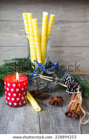 Christmas time picture with candle and fir tree. Selective focus