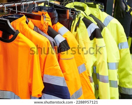 Workwear jackets in construction store Royalty-Free Stock Photo #2288957121