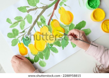 Children's drawing with paints, lemons on a tree.