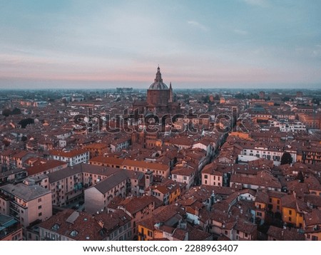 Aerial View Pavia, Italy by drone. Lombardy Italia. Red roofs of houses from above. Italian city. Evening photography from a drone. Cattedrale di Santo Stefano e Santa Maria Assunta. Duomo Pavia