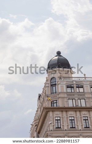A building with a dome and Ukraine flag on the top