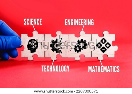 Wooden puzzle connection with STEM icon. science, technology, engineering, mathematics education word with icons.  Royalty-Free Stock Photo #2289000571
