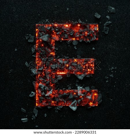A photo of a burning capital letter E on a black background is made of hot coals.