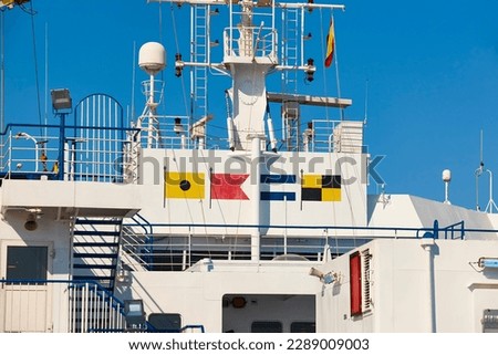 Nautical flags on a cruise ship. Navigation symbols. Transportation Royalty-Free Stock Photo #2289009003