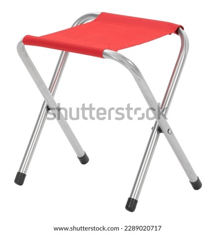 red metal folding camping stool Royalty-Free Stock Photo #2289020717