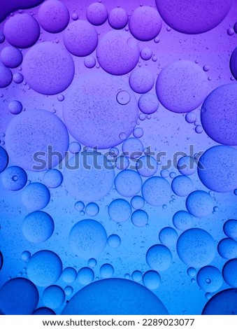 Purple and Blue Colorful artistic of oil on the water. Abstract Colorful Oil bubbles For background.