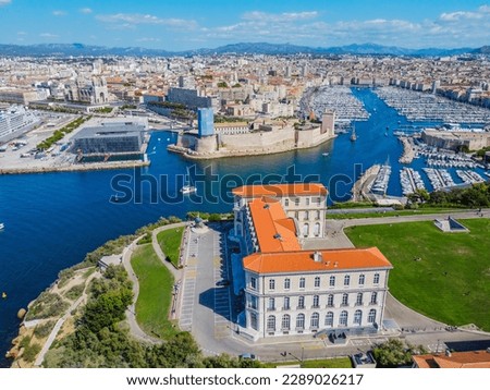 Aero Photography. View from flying drone. Old city center and port of Marseille (Vieux-Port de Marseille) with yachts and Basilique Notre-Dame de la Garde. Top View. Beautiful destinations. Royalty-Free Stock Photo #2289026217