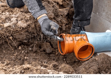plastic pvc waste sewer pipe in the ground. construction site Royalty-Free Stock Photo #2289033511