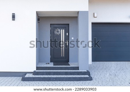 Facade of a modern building with modern doors Royalty-Free Stock Photo #2289033903