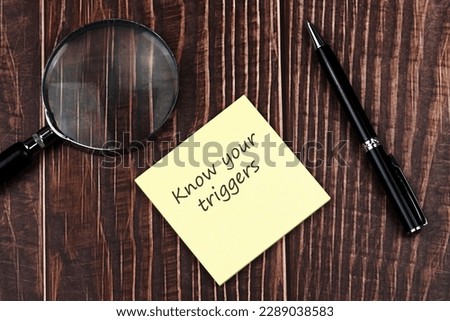 Adhesive note with text know your triggers Royalty-Free Stock Photo #2289038583