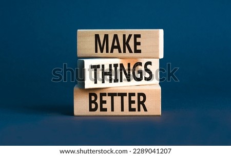 Make things better symbol. Concept words Make things better on wooden block on a beautiful grey table grey background. Business and make things better concept. Copy space.