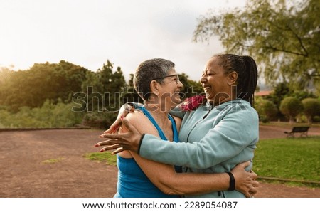 Happy multiracial senior women having fun after workout activities in a public park - Health elderly people concept Royalty-Free Stock Photo #2289054087